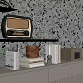 Decorative Ornament Set on Black Shelves with Vintage Radio Books Plant Jars and Speckled Wall