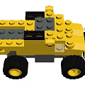 Yellow and Gray Building Blocks Toy Car with Large Black Wheels and Assembled Design