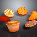 Assorted Colorful Sweet Pastries Featuring Heart Shaped Shell Patterned Triangle and Cup Treats with Sprinkles