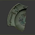 Turquoise Cracked Ceramic Shard Featuring Floral Patterns And Green Plant Motifs
