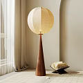 Modern Floor Lamp With Wooden Cone Base And Beige Fabric Shade Near Open Book