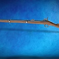 Classic Vintage Rifle With Wooden Stock And Metal Parts Displayed On Blue Background