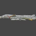 US Navy White Fighter Jet In Flight With Attached Missiles And Military Markings