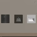 Sleek Black And White Square Wall Lights Mounted On Beige Wall With Warm Lighting