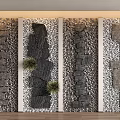 Decorative Stepping Stones Wall Design With Various Stone Arrangements And Green Plants