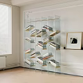 Modern Glass Bookshelf with Multiple Shelves Holding Books Near Window and Framed