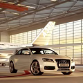 White Audi Car Parked In Modern Airport Hangar With Airplane Background