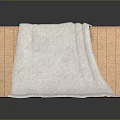 Woven Storage Basket With Soft Light Colored Towel For Home Organization And Daily Use
