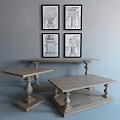 Wooden Coffee Table With Carved Legs And Side Tables Against Gray Wall With Architectural Sketches