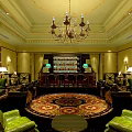 Elegant Bar Interior With Chandelier Bar Counter Green Sofas And Round Rug