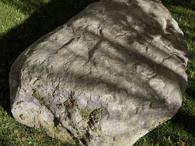 Large Natural Stone Lying on Green Grass With Textured Surface And Tree Shadows 3d model