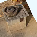 Park Landscape Featuring Stone Basin on Brick Pedestal with Fallen Leaves and Paved Path