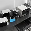 Modern Kitchen Appliances Including Microwave Coffee Maker Oven And Toaster On Dark Table