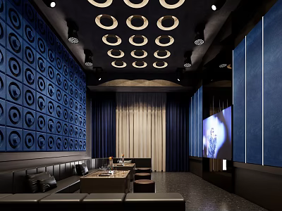 Modern KTV Interior Design With Blue Circular Patterned Walls Dark Sofas And Large Screen TV 3d model