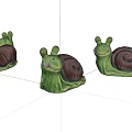 Cute Snail Sculptures With Green Body Dark Brown Shell And Adorable Smiling Face