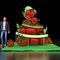 Man Displaying Fresh Strawberry Stacked Tower With Green Base On Black Background
