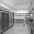 Modern Commercial Kitchen Interior With Stainless Steel Equipment Vent Hoods And White Tiles