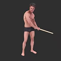 A Shirtless Man Wearing Black Shorts Barefoot Holding Wooden Stick Against Black Background