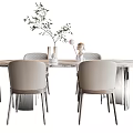 Modern Dining Table Set with Round Marble Tabletop and Light Gray Chairs and Green Plant