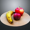 Ripe Banana Red Apple and Purple Plum on a Round Wooden Plate