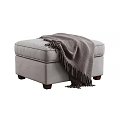 Comfortable Gray Upholstered Ottoman With Cozy Knit Blanket And Wooden Legs