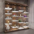 Multi Tiered Wooden Display Shelf with White Shelves Showcasing Decorative Figurines Lighting Against Grey Wall