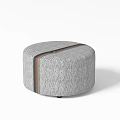 Round Gray Ottoman With Textured Fabric And Brown Accent Stripe For Living Room