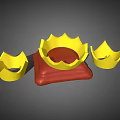 Three Golden Decorative Crown Jewelry Pieces with Central Red Base