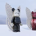 Stylish Bearbrick Figurines With Spiked Wings in Black and Red Against Cloudy Sky