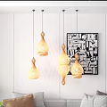 Modern Living Room Interior With Stylish Bamboo Pendant Lights And Abstract Wall Art