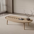 Minimalist Wooden Oval Coffee Table With Teacups Tray And Twig Vase In Living Room