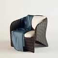 Dark Brown Rattan Leisure Chair With White Cushion And Blue Silk Blanket