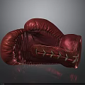 Red Leather Boxing Glove With White Laces On Dark Background