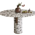 Round Marble Dining Table with Brown Vase Flowers and Green Fruit Plate on Wooden Base