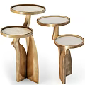 Set of Three Modern Gold Metal Side Tables With Round Top And Elegant Design