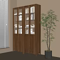 Tall Wooden Bookcase With Glass Doors And Books In Bright Room With Green Plant