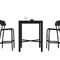 Black Bar Counter With Two High Chairs Wine Glasses And Green Bowl