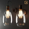Vintage Wall Sconces With Clear Glass Bulbs And Metal Base On Dark Wall