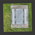 Wooden Picnic Table With Benches On Concrete Base And Grass Area