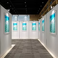 Art Exhibition Hall With White Panels Displaying Blue Paintings Under Bright Lighting And Carpet
