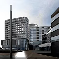 Modern Hospital Building With Glass Curtain Walls Multi Storey Structure And Green Surroundings