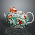 Decorative Teapot With Colorful Fish Patterns And Green Orange Wave Designs