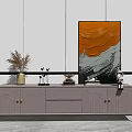 Modern TV Stand with Textured Doors and Gold Handles Featuring Decorative Painting and Vase in Living Room