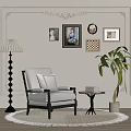 Gray Accent Chair with Armrests on Rug by Wall Art Floor Lamp and Green Plant