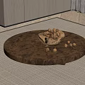Round Wooden Coffee Table With Bowl Of Nuts And Scattered Nuts On Carpet