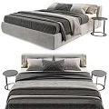 Modern Upholstered Double Bed With Layered Gray Beige Linens and Metal Frame Bedside Table