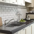 Modern White Kitchen Interior With Cabinets Countertop Sink Cutting Board And Fruits