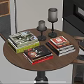 Colorful Books And Magazines On Round Wooden Table With Black Candle Holders And Yellow Candles