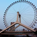 Ferris Wheel Structure Featuring White Support And Blue Water Base Design