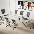 Modern Conference Table With Office Chairs Laptop And Decorative Paintings In Office